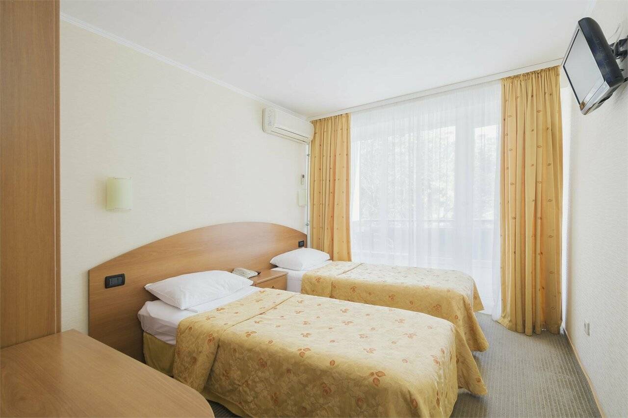 Фотографии номера Стандартный номер с 2-мя односпальными кроватями в Хостеле Магнолия Сочи